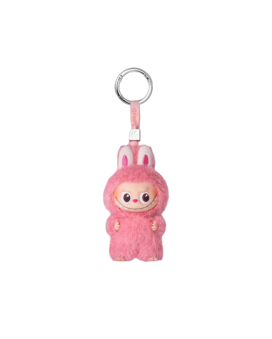 Pink plush Labubu with a character design on a white background